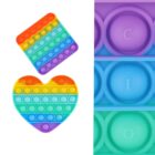 Two colorful pop-it toys: a square and a heart, both with rainbow stripes. The heart is below the square. On the right, a close-up of three circular sections with parts of letters visible: C, I, and O.