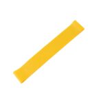 A yellow resistance band lies flat on a white background.