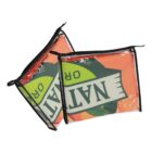 Two transparent rectangular pouches with black trim are placed at an angle. Each pouch contains colorful items and features the word NAT in large letters printed on the front.