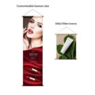 A customizable banner displaying two different designs: a woman with red lipstick and two lipstick tubes, and a rolled paper on large green leaves. Size specified as 500x700 mm.