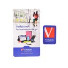 A Verbatim advertisement displaying various tech products such as cases and gadgets. It includes the text Verbatim+ For business on the go. The Verbatim logo and web address are visible. A blurred background shows people walking in a bright space.