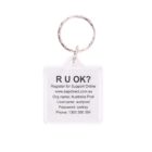 A keychain with a clear square tag displaying text: R U OK? followed by contact information, including a website, organizational name, username, password, and a phone number.