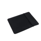 A black, flexible silicone baking sheet with a rectangular shape. The sheet is slightly rolled at one end, showcasing its pliability. The surface is smooth and matte. The background is plain white.