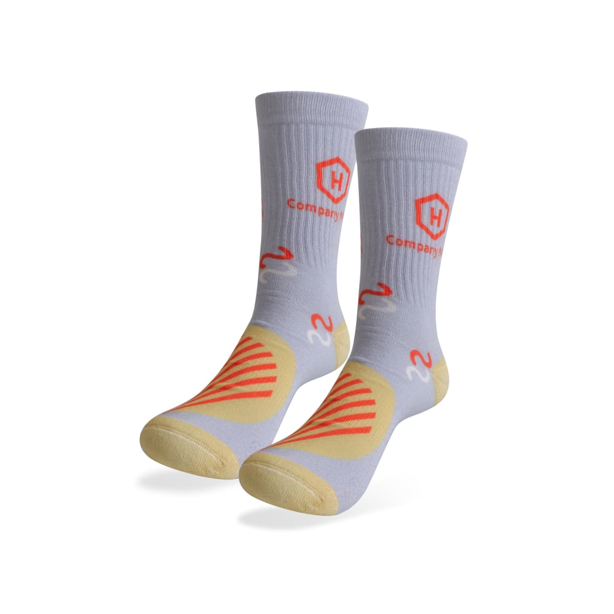 A pair of gray socks with orange and yellow patterns, featuring a hexagonal logo and the word Company in orange. The socks have reinforced toes and heels, designed for athletic use.