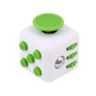A white fidget cube with various textured green buttons and sliders on each side. One side features a metallic ball. The cube is designed to provide sensory interaction and stress relief.