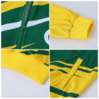 Close-up collage of a colorful jacket featuring a green and yellow design. Top left shows a zippered front with a curved white line, top right displays a yellow wrist cuff, and bottom right highlights a green-trimmed yellow pocket.