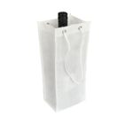 White fabric gift bag with a drawstring handle, holding a black bottle with a screw cap. The bag is standing upright against a plain white background.
