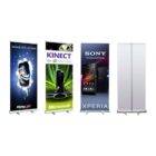 Four retractable banners: 1) Pepsi Max can with dark background, 2) Xbox Kinect with neon green accents, 3) Sony Xperia smartphones, dark blue background, 4) Blank banner with metal base.