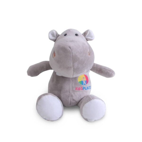A grey hippo plush toy with white feet, sitting upright. It features a colorful logo with the text kidSPACE on its belly. The plush has a soft, rounded appearance with small ears and a friendly expression.