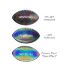 Three footballs with akademiks logo show different lighting effects. Top: No light reflection, appearing matte. Middle: Light reflection, showing a colorful sheen. Bottom: Camera flash Glow Effect, displaying bright, vivid rainbow colors.