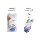 Image showing two pairs of socks with blue and orange geometric patterns. The left pair is in plastic with Standard packaging text above. The right pair has a cardboard hanger with Custom header card text above.