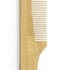 A wooden comb with a curved handle and fine teeth, designed for grooming hair. The natural wood grain pattern is visible, giving it an organic and eco-friendly appearance.
