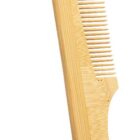 A bamboo comb with fine teeth and a curved handle. The word BAMBOO is written in green below the comb.