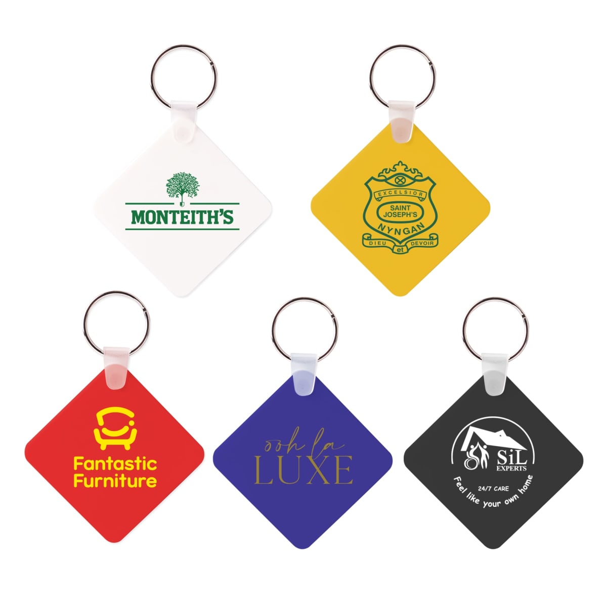 Five rectangular keychains with metal rings, featuring different designs: white with Monteiths logo, yellow with a vintage logo, red with Fantastic Furniture text, blue with osh la LUXE text, and black with SIL experts text and logo.