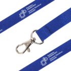 Close-up of a blue lanyard with a silver swivel hook. The lanyard features white text and a logo with gears, reading Numeracy Initiative 2017 and Tamworth Operational Directorate.