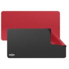 A rectangular, reversible desk mat with one side black and the other red. The corner of the mat is flipped to show both colors. A small brand logo is visible on the black side.