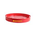 Red circular serving tray with the word passion and a small logo printed in yellow on the side. Inside, there is a white graphic design with the word Budweiser.