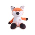 A plush toy fox with orange and white fur, large pointed ears, and a friendly expression sits against a white background. The fox features a small multicolored logo on its chest and has dark brown paws and ear tips.