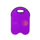 A purple neoprene tote bag with a black handle. It features a lion logo and the text Lionica Studios in gold.