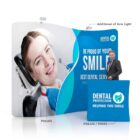 A man in a suit stands beside a dental promotion booth with a large display featuring a smiling patient in a dental chair. The text reads, Be proud of your smile, Best Dental Service, and Dental Protection, Helping You Smile. Booth items are labeled POS305, POS320/POS92.