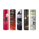Five standing cylindrical display banners showcasing different product advertisements, each featuring distinct designs and branding. The banners include various text, images of products, and promotional information.
