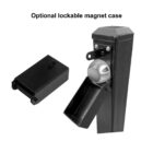 Black lockable magnet case attached to a vertical pole, shown open with a round mechanism inside. Another identical case is displayed next to the pole, highlighting its optional feature.