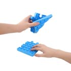 Two hands are shown holding blue pop-it fidget toys. One hand holds a plane-shaped pop-it, while the other presses a square pop-it. The fidget toys have bubble-like buttons on them.
