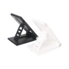 Two adjustable foldable stands, one black and one white, positioned side by side at an angle against a white background. Both stands are in an A-frame shape, designed to hold tablets or smartphones.