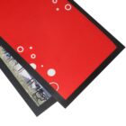 Two overlapping mats, one red with white circles and one with a nature photo and black border.