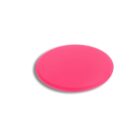 A bright pink disc lies flat against a white background, casting a subtle shadow beneath it.