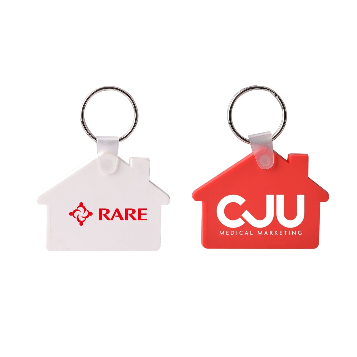 Two house-shaped keychains are shown, one white with a logo and the word RARE, and the other red with the text CJU Medical Marketing. Both have metal key rings attached at the top.
