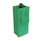 Green, reusable wine tote bag with rope handles and grommets, partially concealing a bottle neck.