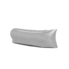 A gray inflatable air lounger, shaped like a hammock, is positioned at an angle against a white background.