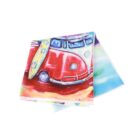 Colorful towel featuring a vintage red van with floral surfboards on the roof. The background includes vibrant beach-themed hues of blue and yellow.
