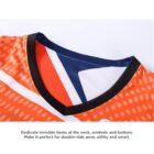Close-up of an orange and white sports jersey with a V-neck featuring a black edge. The fabric has a polka dot pattern and sharp geometric design in navy, white, and red inside. Text below notes invisible hems for double-sided wear and smart utility.