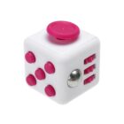 A white fidget cube featuring pink buttons and a pink joystick on different sides. It also has a silver metal ball and dials on another side, designed for stress relief and focus enhancement.