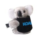 Plush koala toy with black and blue KOALA text on its body, set against a plain white background. The toy is gray with large, fluffy ears and a relaxed expression.