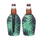 Two brown beer bottles are covered with green palm-leaf patterned neoprene sleeves. One sleeve shows a black zipper running down the front, while the other has the same pattern with no visible zipper. Both are set against a white background.