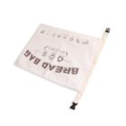 A reusable cloth bread bag with illustrations and text, including BREAD BAG and REUSABLE. It features icons of bread and recycling symbols, along with a strap and buckle closure on a white background.