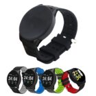 Five smartwatches with circular faces are displayed, each with different colored wristbands: black, gray, light blue, green, and red with black. The foreground watch is black with a blank screen.