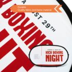 Close-up of a promotional sign with bold red text reading KICK BOXING NIGHT and a smaller sign showing the same text. Above, an orange banner states Durable Quality fabric and frame material.