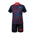 A sports outfit with a short-sleeve shirt and shorts. The shirt features a blue and red radial stripe pattern emanating from the shoulder. The black shorts have ABSTRACT HALFTONE written in red on the right leg.