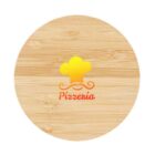 A round wooden pizza board with a yellow chefs hat and mustache logo, featuring the text Pizzenia in red.
