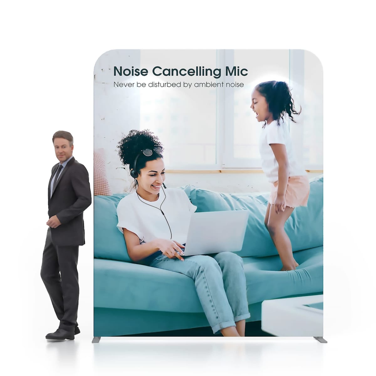 A woman sits on a teal sofa with a laptop, wearing earphones. A child joyfully jumps beside her. A man in a suit walks past, and text above them reads: Noise Cancelling Mic - Never be disturbed by ambient noise.