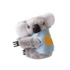 A plush koala holds a blue and orange bag with an abstract design. The koala has a gray body and white ears, and it appears to be seated.