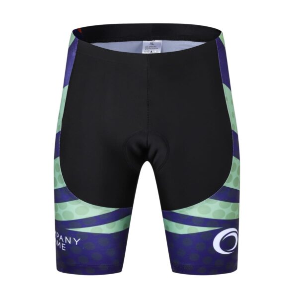 Cycling shorts in black with green and purple geometric patterns on the sides. The shorts feature a logo and the text COMPANY NAME near the hem. The design includes subtle circles within the colored areas.