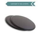 Two black circular exercise sliders are shown on a white background. Above them, there is a teal label with an arrow design, stating, Lightweight for easy portability.