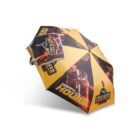 A yellow and black umbrella with the text Cold Beer Happy Hour displayed on each panel. The design features images of beer glasses and a tap. A related square card or label is attached to the umbrella handle.