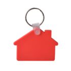 Red house-shaped keychain with a silver metal ring attached. The house design is simple, featuring a triangular roof and a small chimney on the right side. The keychain is set against a plain white background.