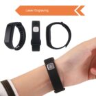 A hand wears a black wristband with a metal plate. Three variations of the wristband are shown, including top, side, and back views. The words Laser Engraving with an orange arrow point to the bands, indicating customization.